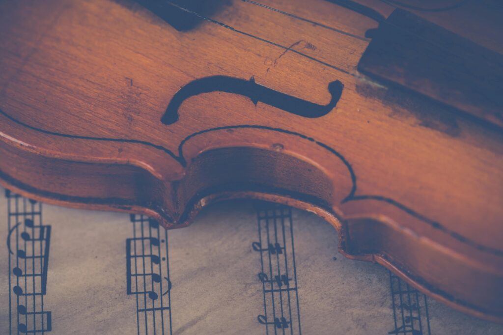 pexels photo 697672 697672 Artistic close-up of a violin on sheet music, highlighting musical elegance.